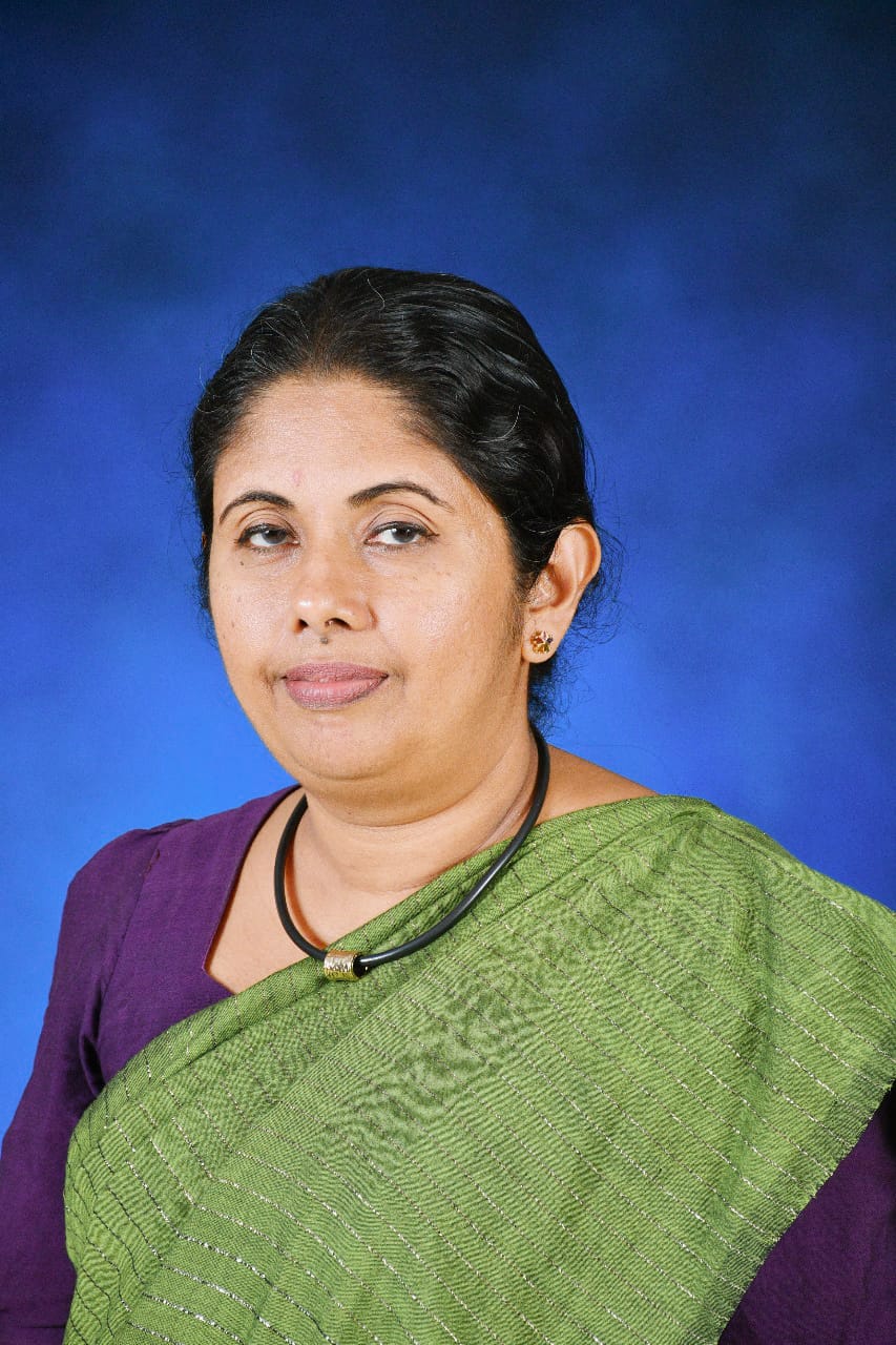 Mrs. M.M. Priyangika speaking at a podium